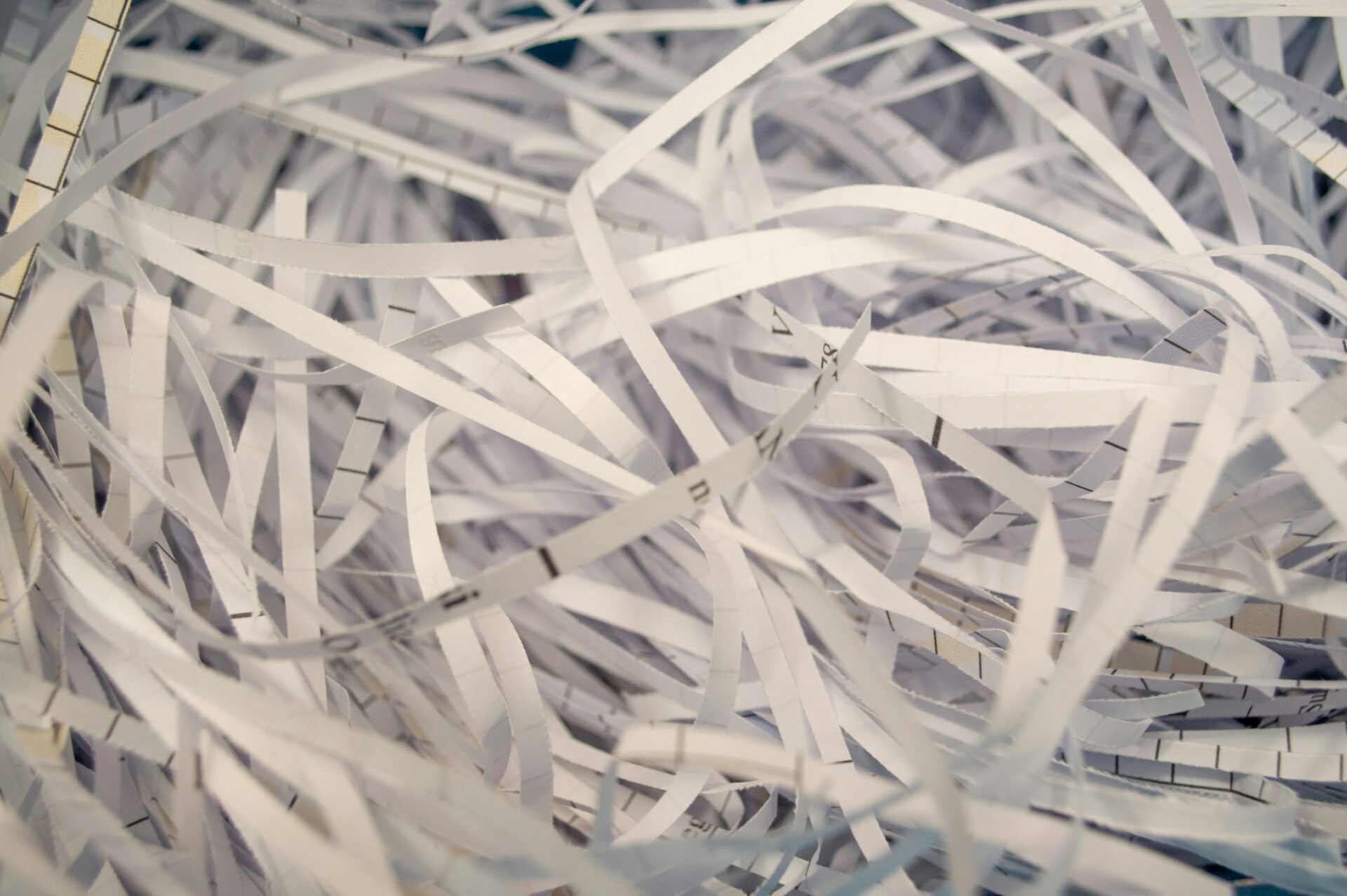 a pile of white shredded paper sitting on top of a table